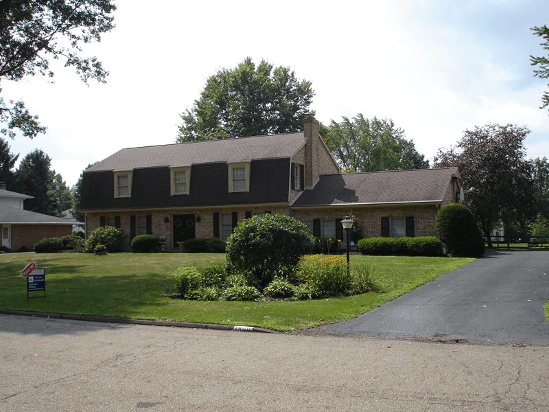 Exterior of large older brick home
